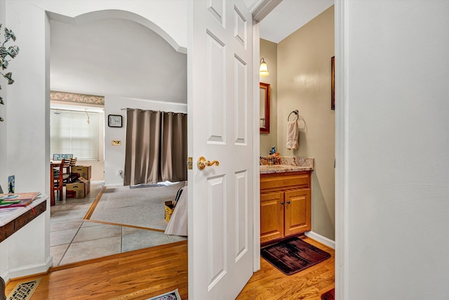 72 Windsor Ct, Roanoke, VA 24019 - bathroom featuring vanity, baseboards, and wood finished floors