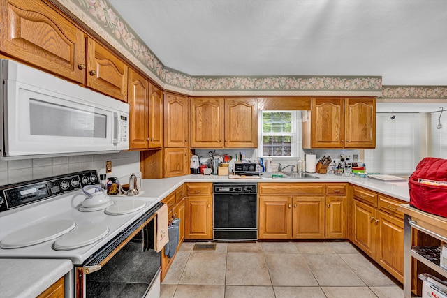 72 Windsor Ct, Roanoke, VA 24019 - kitchen with white appliances, a sink, light countertops, and brown cabinetry