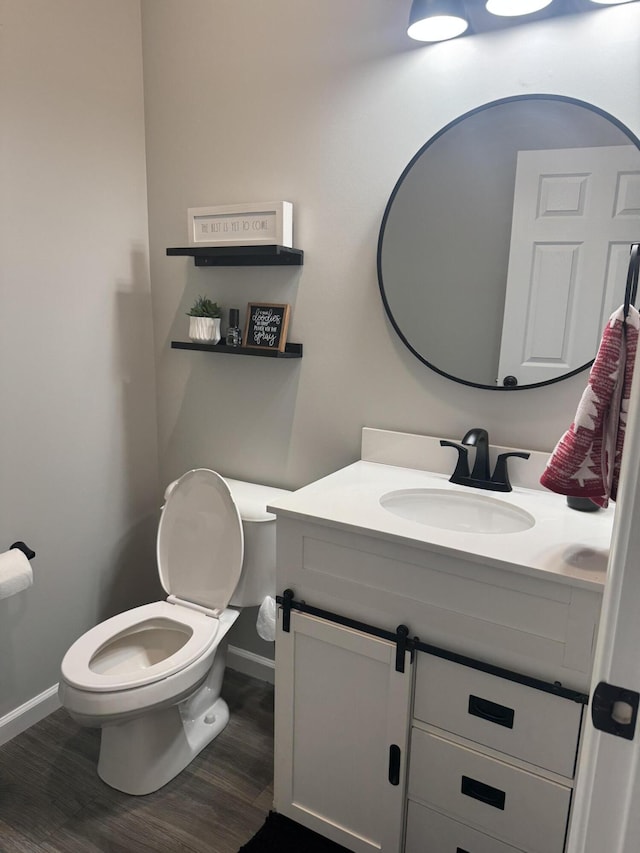 doorway with wood finished floors and baseboards