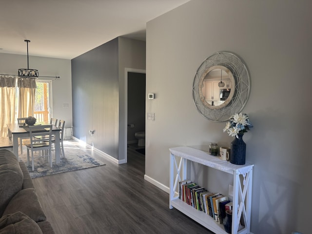 carpeted bedroom featuring baseboards