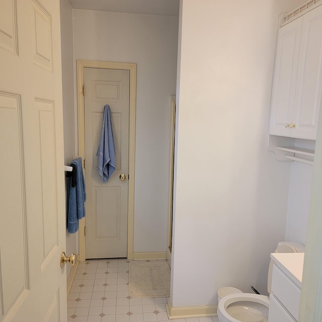 1106 Hogan Rd, Blue Ridge, VA 24064 - bathroom with vanity, tile patterned floors, baseboards, and toilet