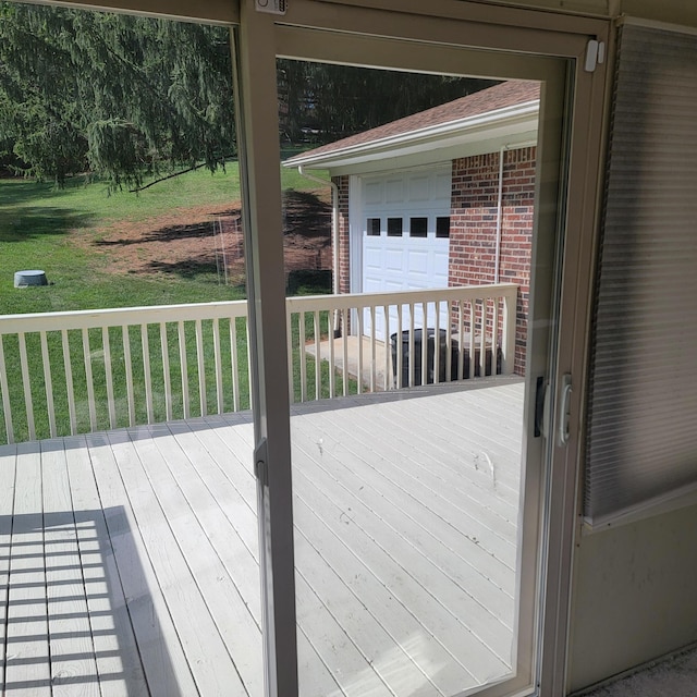1106 Hogan Rd, Blue Ridge, VA 24064 - wooden deck featuring a garage and a lawn