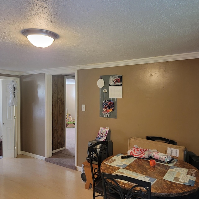 1106 Hogan Rd, Blue Ridge, VA 24064 - dining area featuring crown molding, light wood-style floors, and a textured ceiling