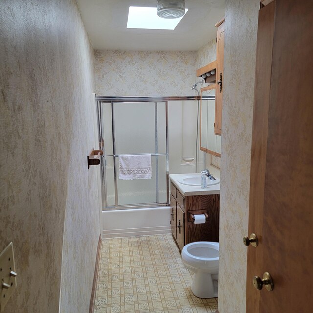 1106 Hogan Rd, Blue Ridge, VA 24064 - full bathroom featuring vanity, toilet, wallpapered walls, tile patterned floors, and combined bath / shower with glass door