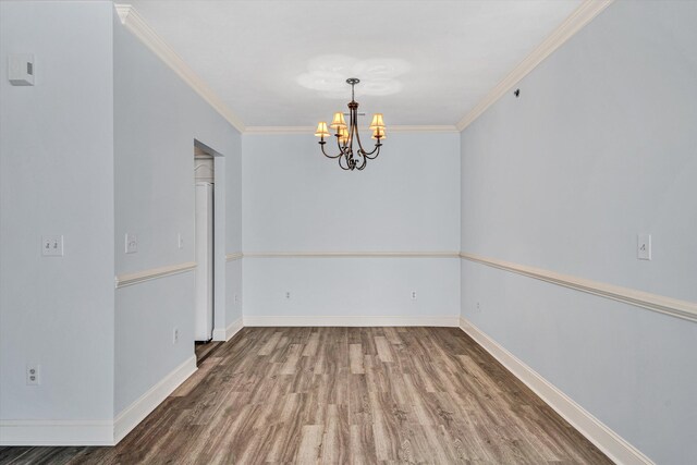 4444 Pheasant Ridge Rd Unit 206, Roanoke, VA 24014 - unfurnished room with crown molding, baseboards, wood finished floors, and a notable chandelier
