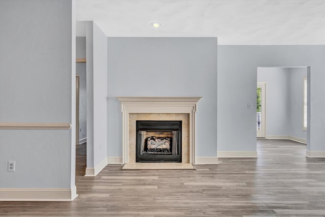 4444 Pheasant Ridge Rd Unit 206, Roanoke, VA 24014 - unfurnished living room featuring baseboards, a fireplace, and wood finished floors