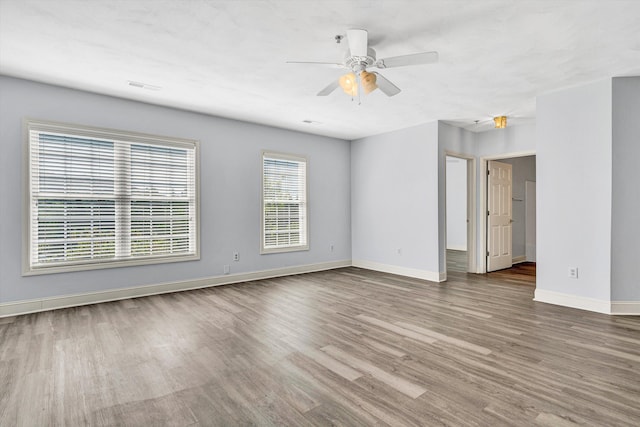 4444 Pheasant Ridge Rd Unit 206, Roanoke, VA 24014 - unfurnished room featuring baseboards, ceiling fan, wood finished floors, and visible vents