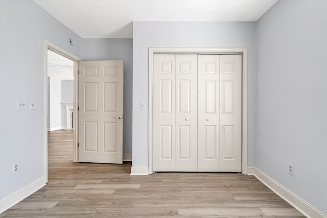 4444 Pheasant Ridge Rd Unit 206, Roanoke, VA 24014 - unfurnished bedroom featuring baseboards, a closet, and light wood finished floors