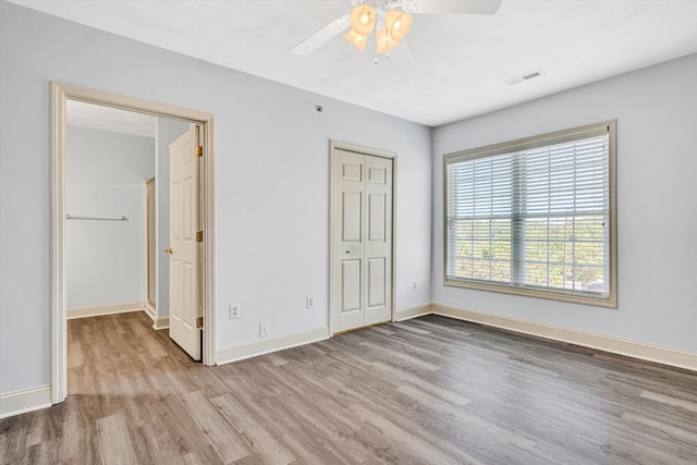 4444 Pheasant Ridge Rd Unit 206, Roanoke, VA 24014 - unfurnished bedroom featuring visible vents, a closet, wood finished floors, baseboards, and a ceiling fan