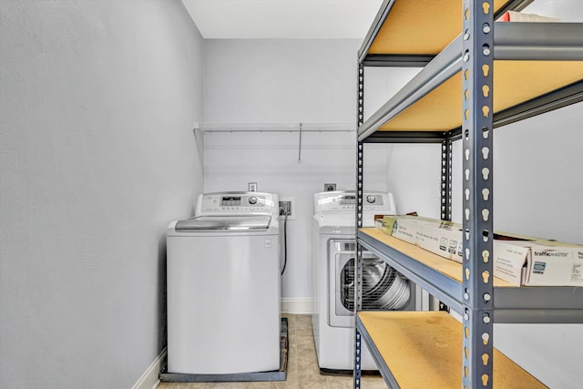 4444 Pheasant Ridge Rd Unit 206, Roanoke, VA 24014 - laundry room with baseboards, washer and clothes dryer, and laundry area