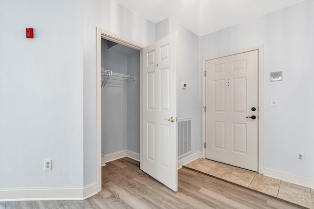 4444 Pheasant Ridge Rd Unit 206, Roanoke, VA 24014 - foyer featuring baseboards, wood finished floors, and visible vents