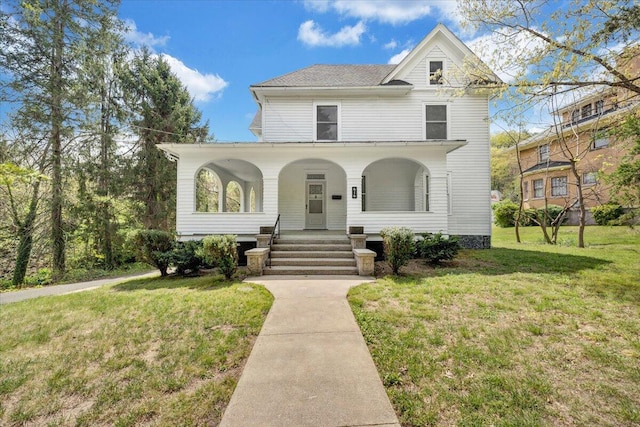 view of front of home featuring a front yard and a porch