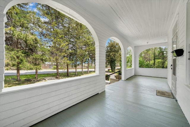 unfurnished sunroom with plenty of natural light