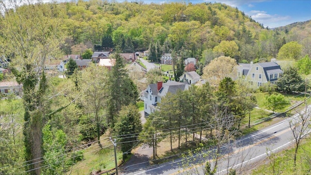 drone / aerial view with a view of trees
