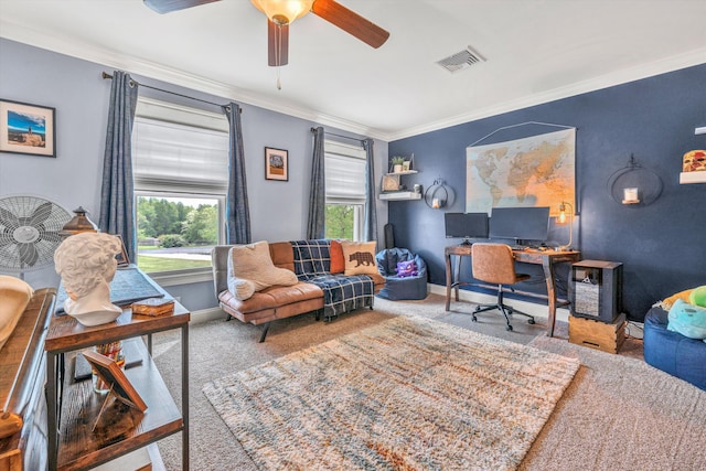 carpeted home office featuring ornamental molding, baseboards, a ceiling fan, and visible vents