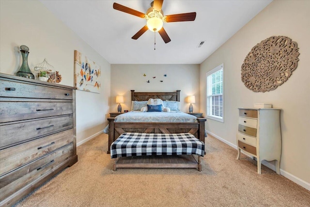 bedroom with light carpet, baseboards, and ceiling fan