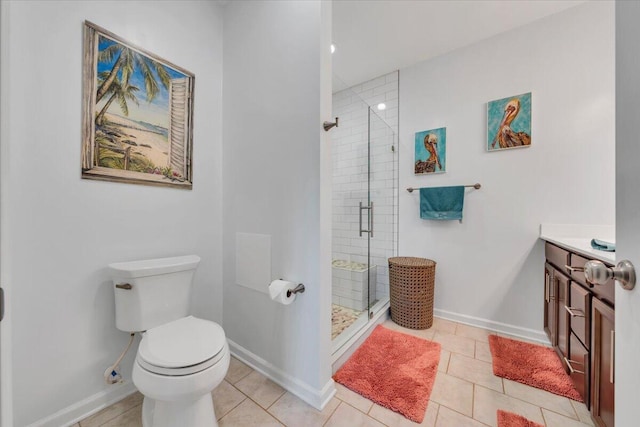 full bath with toilet, a stall shower, baseboards, and tile patterned flooring