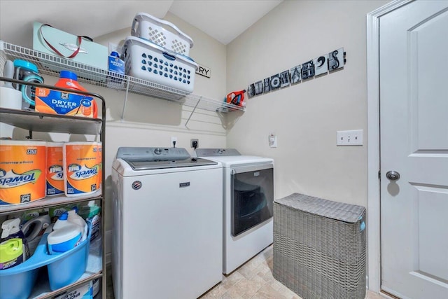 washroom featuring washer and clothes dryer