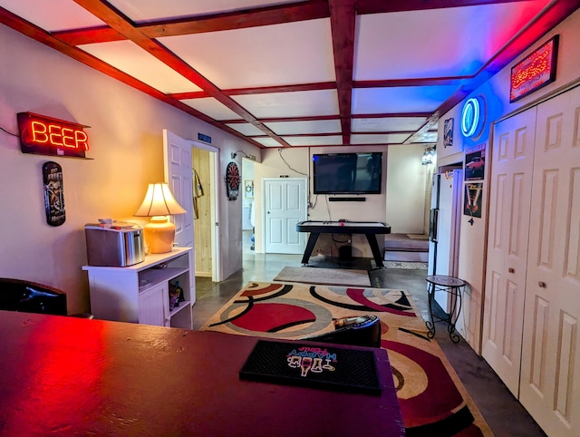 rec room with beam ceiling, baseboards, and coffered ceiling