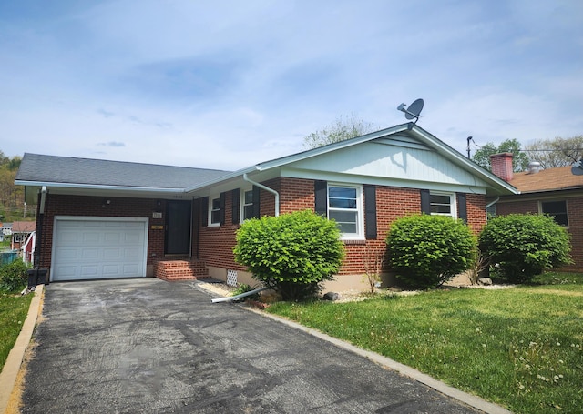 1322 S David Ave, Covington, VA 24426 - ranch-style home featuring driveway, an attached garage, entry steps, a front yard, and brick siding