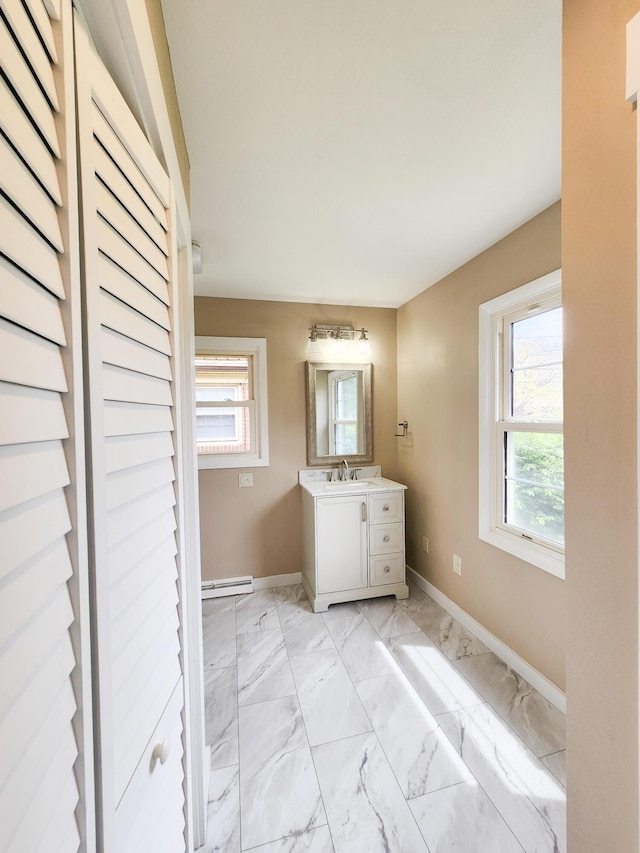 1322 S David Ave, Covington, VA 24426 - bathroom featuring a wealth of natural light, marble finish floor, and vanity