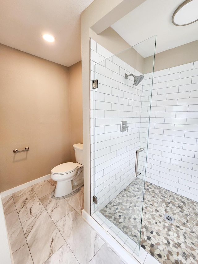 1322 S David Ave, Covington, VA 24426 - bathroom with marble finish floor, baseboards, toilet, and a stall shower
