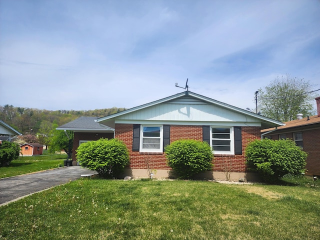 1322 S David Ave, Covington, VA 24426 - bungalow-style home with brick siding, aphalt driveway, and a front yard
