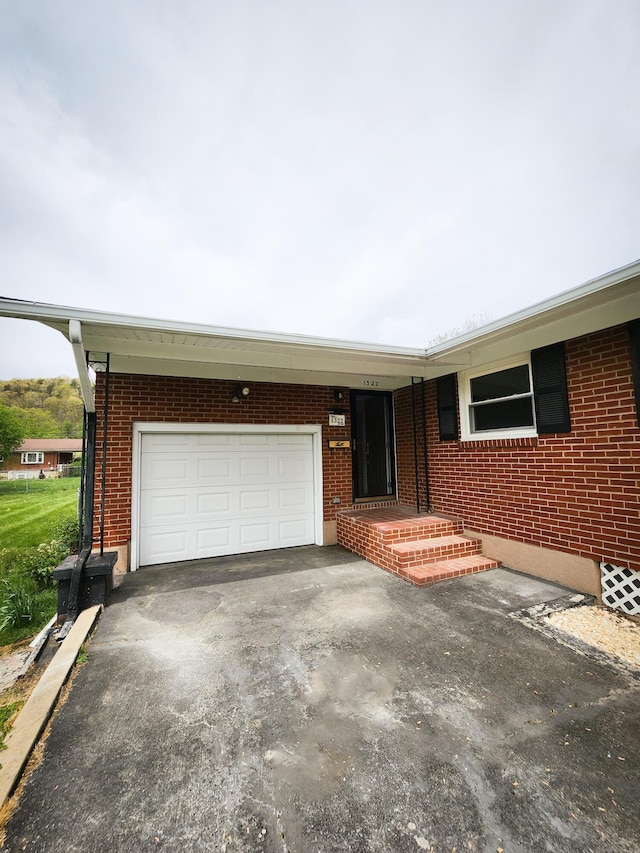 1322 S David Ave, Covington, VA 24426 - ranch-style house with a garage, brick siding, and driveway