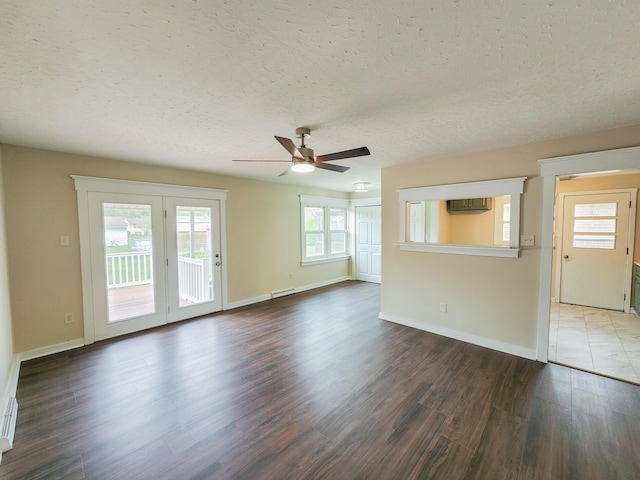 1322 S David Ave, Covington, VA 24426 - unfurnished living room with ceiling fan, baseboards, wood finished floors, and a textured ceiling