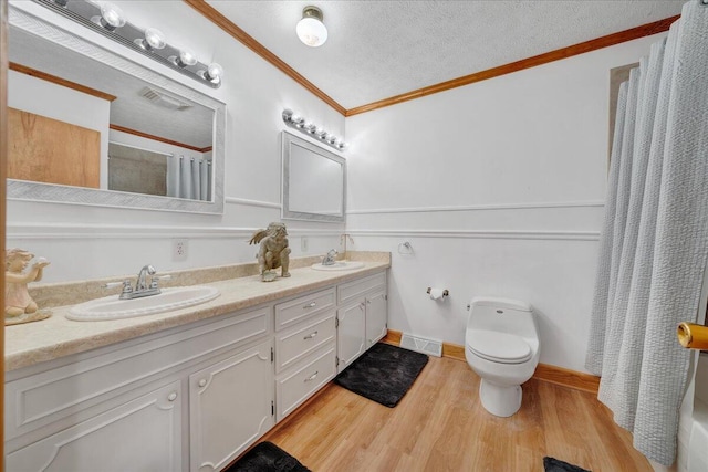 350 Tracy Dr, Moneta, VA 24121 - bathroom with double vanity, a shower with curtain, a textured ceiling, wood finished floors, and ornamental molding