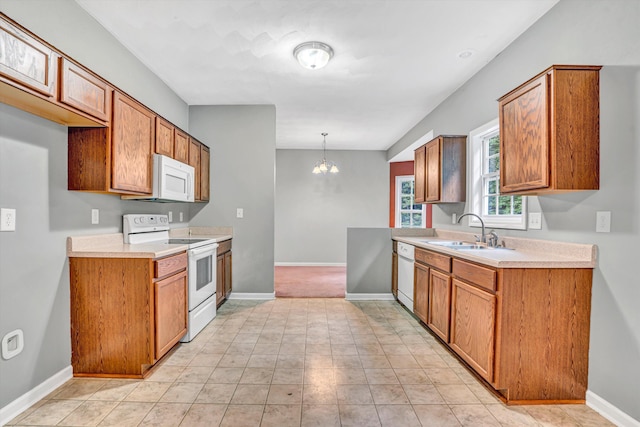 1920 Connors Ct, Salem, VA 24153 - kitchen with white appliances, a sink, light countertops, and brown cabinetry