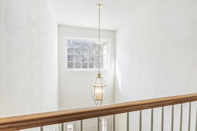 interior details featuring a notable chandelier
