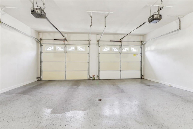 garage featuring baseboards and a garage door opener