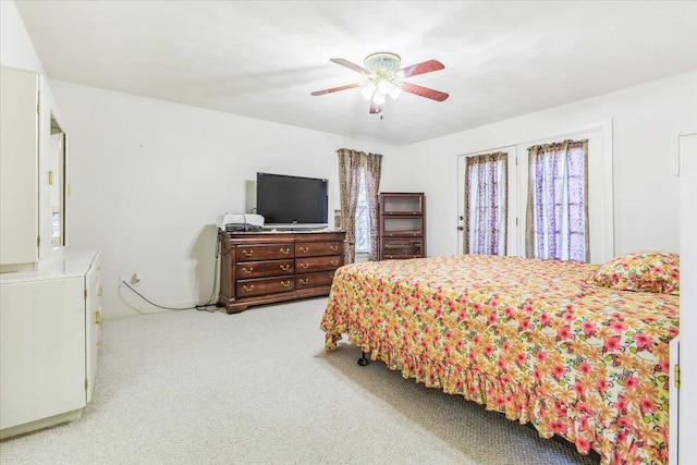 bedroom with a ceiling fan and carpet floors