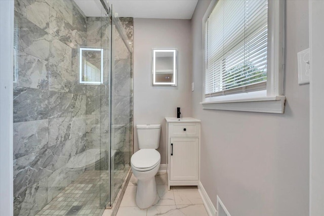 bathroom with toilet, baseboards, marble finish floor, a shower stall, and vanity