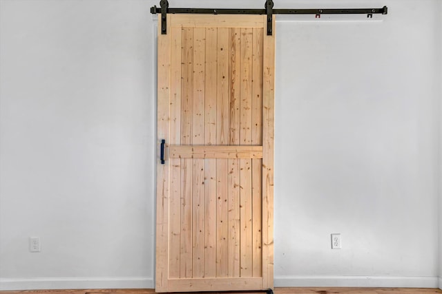 2288 Mud Pike Rd, Christiansburg, VA 24073 - unfurnished room with a barn door and baseboards
