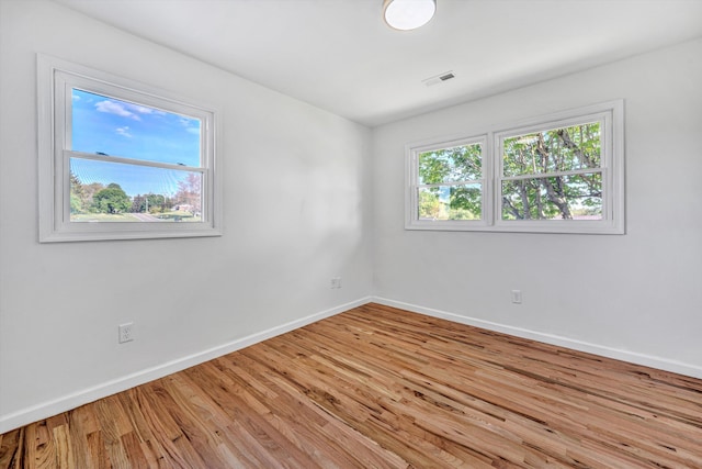 2288 Mud Pike Rd, Christiansburg, VA 24073 - spare room featuring visible vents, light wood finished floors, and baseboards