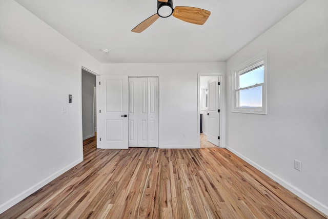 2288 Mud Pike Rd, Christiansburg, VA 24073 - unfurnished bedroom with light wood finished floors, a closet, ceiling fan, baseboards, and ensuite bathroom