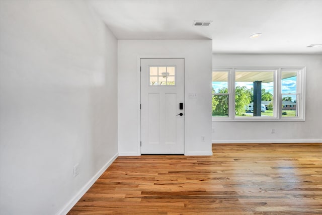 2288 Mud Pike Rd, Christiansburg, VA 24073 - foyer entrance with visible vents, wood finished floors, and baseboards
