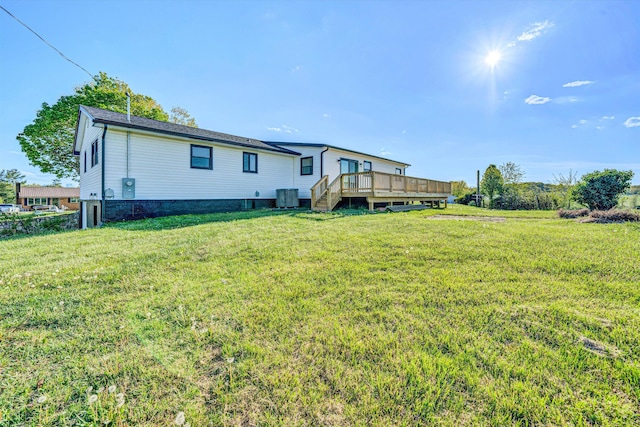 2288 Mud Pike Rd, Christiansburg, VA 24073 - back of property with a wooden deck, cooling unit, and a yard