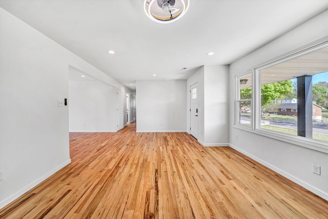 2288 Mud Pike Rd, Christiansburg, VA 24073 - unfurnished living room featuring light wood-type flooring, recessed lighting, and baseboards