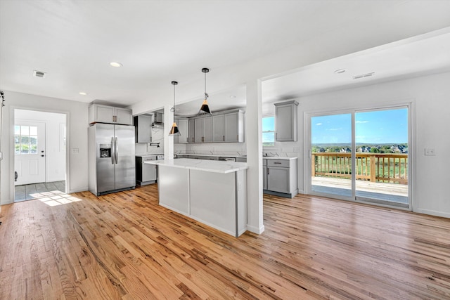 2288 Mud Pike Rd, Christiansburg, VA 24073 - kitchen featuring visible vents, gray cabinets, light wood-style flooring, and stainless steel fridge with ice dispenser