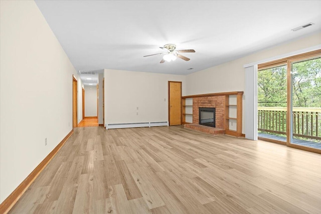 830 Dexter Rd, Roanoke, VA 24019 - unfurnished living room with a baseboard heating unit, light wood-type flooring, and visible vents
