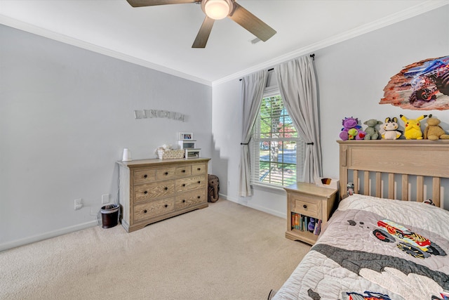 bedroom featuring baseboards, ornamental molding, carpet, and a ceiling fan