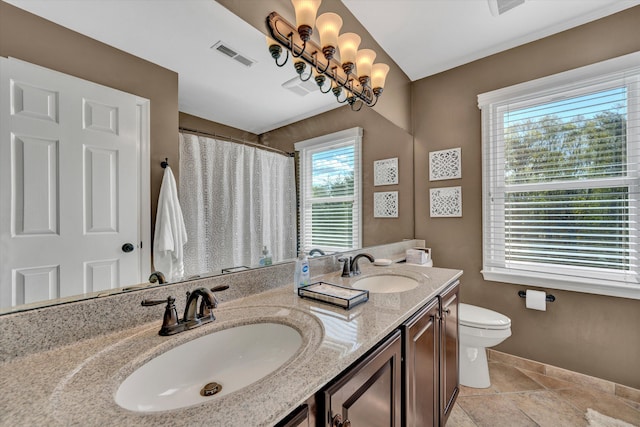 full bathroom with a sink, baseboards, toilet, and visible vents