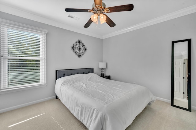 bedroom featuring a ceiling fan, visible vents, baseboards, ornamental molding, and carpet