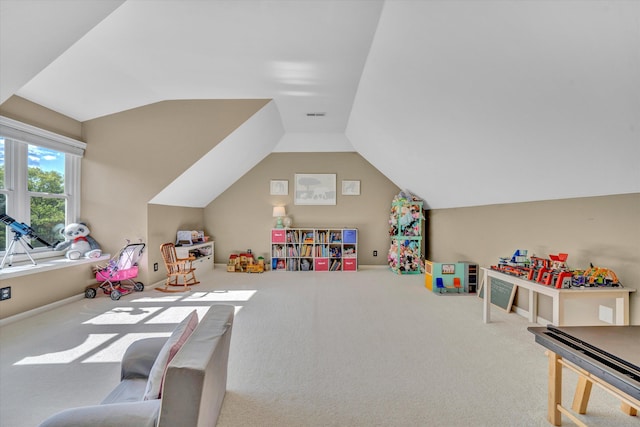 rec room featuring visible vents, vaulted ceiling, and carpet