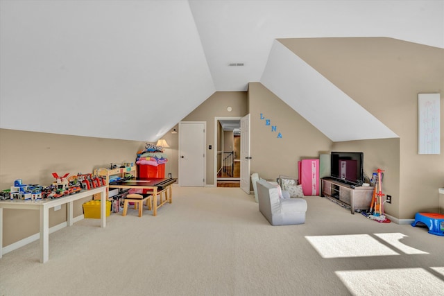 rec room featuring carpet, vaulted ceiling, and visible vents