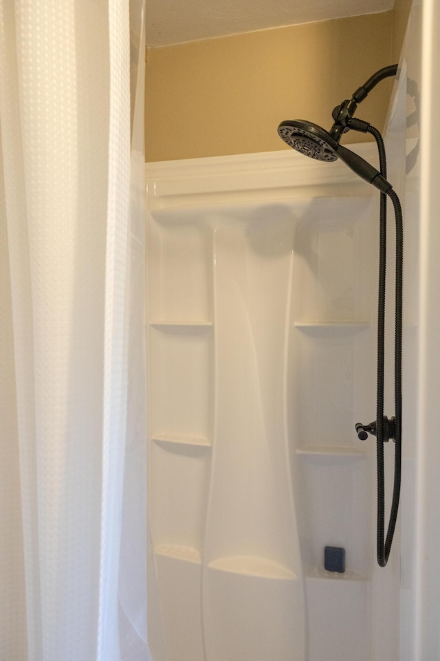 bathroom with a shower with shower curtain