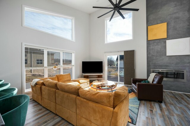 101 Retreat Ln, Huddleston, VA 24104 - living area with a fireplace, wood finished floors, a high ceiling, and ceiling fan